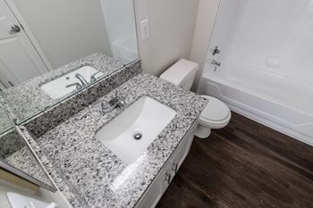 Renovated bathrooms with quartz counters