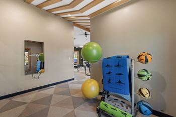 A room with balloons and a stroller and a suitcase