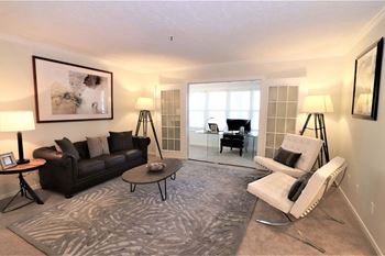 A living room with a couch and a chair