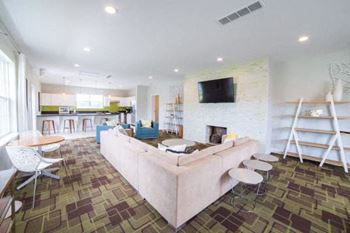 A living room with a fireplace and a couch.