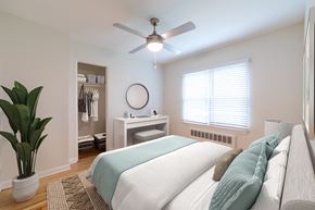 Indianapolis apartment for rent - a bedroom with a bed and a ceiling fan