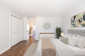 Indianapolis apartment for rent - a bedroom with white walls and hardwood floors