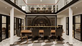 Philadelphia apartment for rent - a dining room with a table and chairs in front of a restaurant sign