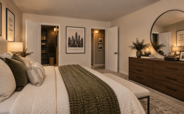 Philadelphia apartment for rent - A bedroom with a large bed and a mirror on the wall.