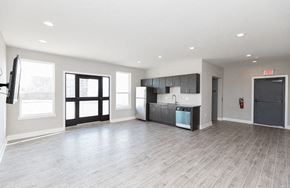 Warminster apartment for rent - an empty room with a kitchen and a door