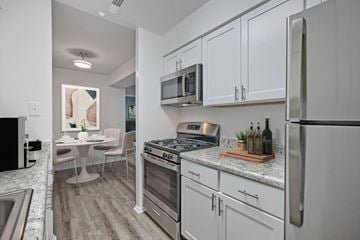 Lebanon apartment for rent - A kitchen with white cabinets and stainless steel appliances.