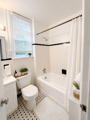 Bryn Mawr apartment for rent - A white bathroom with a toilet, sink, and bathtub.
