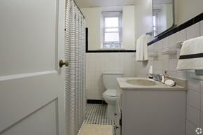 Wilmington apartment for rent - A bathroom with a white sink and a white toilet.