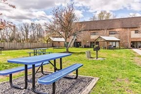 Blackwood apartment for rent - A blue picnic table and bench in a park.