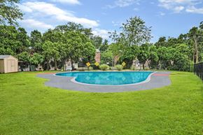 Feasterville apartment for rent - A round swimming pool surrounded by a grassy area.