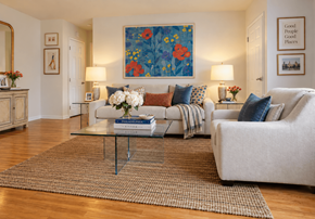 Philadelphia apartment for rent - A living room with a white couch, a coffee table, and a painting on the wall.