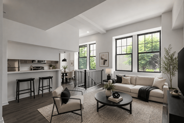 Wilmington apartment for rent - A modern living room with a black coffee table and a white sofa.