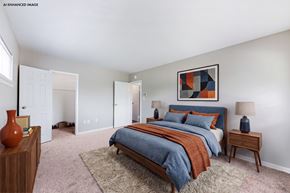 Camp Hill apartment for rent - A bedroom with a bed, nightstands, and a rug.