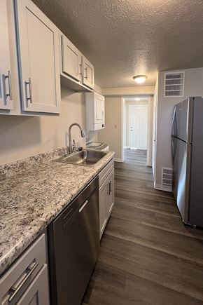 Horseheads apartment for rent - A kitchen with a granite counter top and stainless steel appliances.