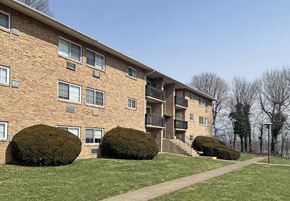 Camp Hill apartment for rent - A brick building with a balcony on the second floor.