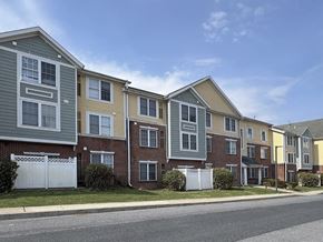 Camp Hill apartment for rent - A row of townhouses with different colored siding.