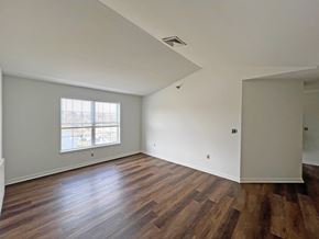 Camp Hill apartment for rent - A room with wooden floors and a window.