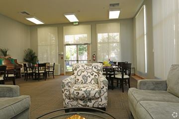 Santa Clarita apartment for rent - A living room with a patterned chair in the center.