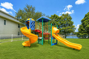 Orlando apartment for rent - A yellow and blue slide in a playground.