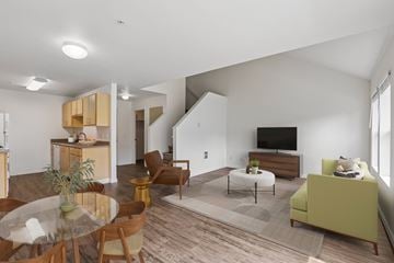 Vancouver townhouse for rent - A living room with a glass table and a green couch.