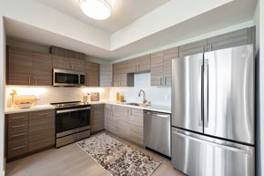 San Rafael apartment for rent - Bright Kitchen with Wood Flooring, Stainless Steel Appliances, and Tiled Backsplash at Second & B Street, San Rafael, CA