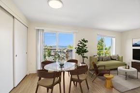 Troutdale apartment for rent - A dining room with a table set for two and a view of the balcony.