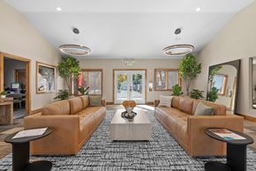 Reno apartment for rent - A Living Room With a Wooden Coffee Table at ALTITUDE BY VINTAGE, Nevada, 89523