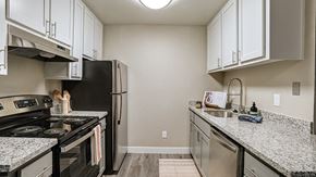 Hayward apartment for rent - Pet Friendly apartments in Hayward CA - Austin Commons - upgraded kitchen with stainless steel appliances, white cabinetry, granite countertops