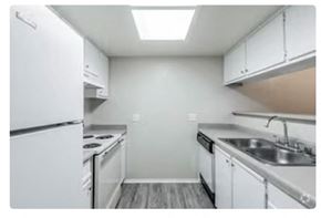 Sacramento apartment for rent - a kitchen with a stove a sink and a refrigerator