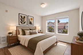 Vancouver townhouse for rent - A bedroom with a large bed and a view of the outside.