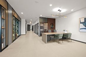 Shoreline apartment for rent - A modern office space with a long hallway, a reception desk, and a framed picture on the wall at Two 10 by Vintage, Shoreline