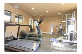 Sacramento apartment for rent - a room filled with lots of exercise equipment