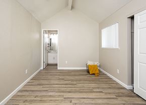 Rohnert Park apartment for rent - Pet-Friendly Apartments in Rohnert Park, CA - Americana - Bedroom with Bathroom Entrance, Sliding Closet Doors, and Large Window