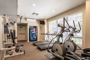 Sacramento triplex for rent - Ashford Park fitness center with cardio and weight equipment