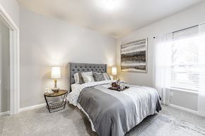 Sacramento apartment for rent - a bedroom with a bed and a window