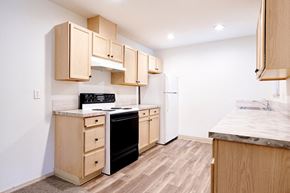 Battle Ground apartment for rent - Kitchen with Wood-Style Flooring at Devonwood and First Place Apartments, Battle Ground, WA