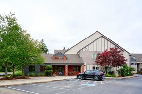 Battle Ground apartment for rent -  leasing office entrance with parking at Devonwood and First Place Apartments, Battle Ground, WA