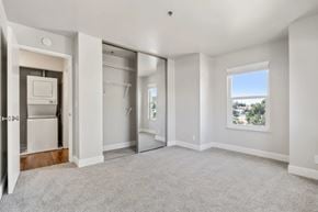 Castro Valley apartment for rent - A spacious, empty room with a window overlooking a landscape.