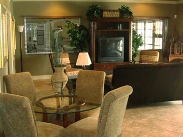 Fort Myers apartment for rent - a living room with a table and chairs and a television
