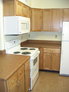 Portland apartment for rent - Kitchen With Cabinets at Bridge Meadows North Portland 55+, Portland