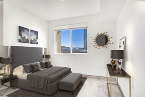 Sparks apartment for rent - Apartments in Sparks for Rent - The Bridges at Victorian Square - Furnished Bedroom with Large Window and Carpet Flooring