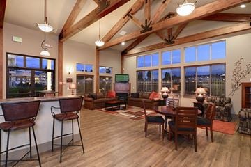 Spokane apartment for rent - a large living room with a dining room table and chairs
