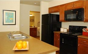 Kennewick apartment for rent - Fully equipped kitchens with black kitchen appliances