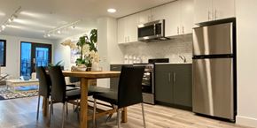 Oakland apartment for rent - A modern kitchen with a dining table and chairs.