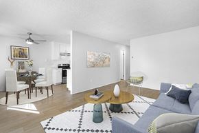 El Cajon apartment for rent - Furnished living room near dining and kitchen with wood floors