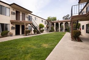 Spring Valley apartment for rent - Exterior view of apartment buildings with grass