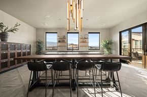 Reno apartment for rent - A modern dining room with a long table and chairs.