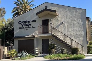 Los Angeles apartment for rent - a building with stairs and a sign on the side of it