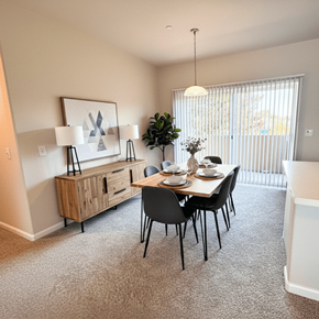 Sacramento apartment for rent - A dining room with a table set for two and a potted plant at Cottages at Laguna, Sacramento, CA