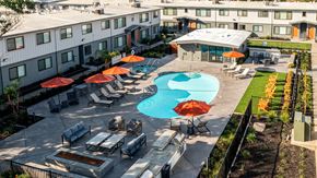 Sacramento apartment for rent - an aerial view of a swimming pool and patio with umbrellas
